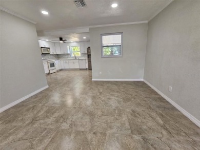 This beautifully brand new updated 3-bedroom, 2-bathroom home on Bayou Golf Club in Florida - for sale on GolfHomes.com, golf home, golf lot