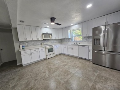 This beautifully brand new updated 3-bedroom, 2-bathroom home on Bayou Golf Club in Florida - for sale on GolfHomes.com, golf home, golf lot