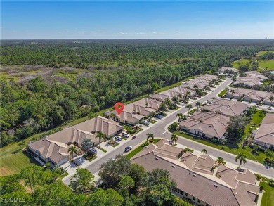 This sunny END UNIT attached villa in HERONS GLEN COUNTRY CLUB's on Herons Glen Golf and Country Club in Florida - for sale on GolfHomes.com, golf home, golf lot