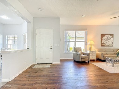 This sunny END UNIT attached villa in HERONS GLEN COUNTRY CLUB's on Herons Glen Golf and Country Club in Florida - for sale on GolfHomes.com, golf home, golf lot