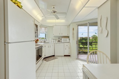 WELCOME TO THIS CONDO WITH BEAUTIFUL WATER,GARDEN & GOLF VIEWS on Poinciana Golf Club in Florida - for sale on GolfHomes.com, golf home, golf lot