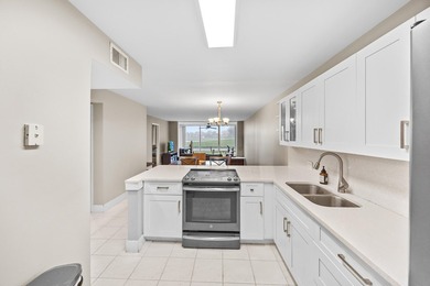 Wake up to tranquil lake and golf course views in this on Fountains Golf and Country Club in Florida - for sale on GolfHomes.com, golf home, golf lot