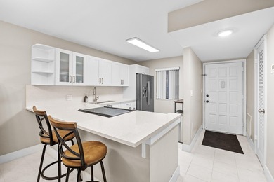 Wake up to tranquil lake and golf course views in this on Fountains Golf and Country Club in Florida - for sale on GolfHomes.com, golf home, golf lot