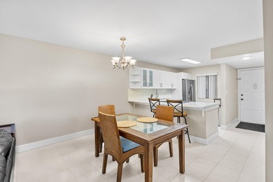 Wake up to tranquil lake and golf course views in this on Fountains Golf and Country Club in Florida - for sale on GolfHomes.com, golf home, golf lot