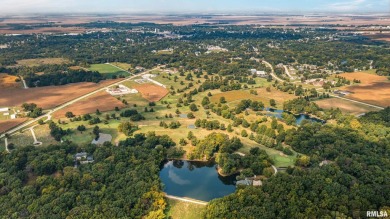 Nestled along the tranquil shores of a pristine lake, this on Carlinville Country Club in Illinois - for sale on GolfHomes.com, golf home, golf lot