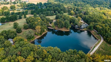 Nestled along the tranquil shores of a pristine lake, this on Carlinville Country Club in Illinois - for sale on GolfHomes.com, golf home, golf lot