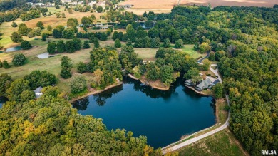 Nestled along the tranquil shores of a pristine lake, this on Carlinville Country Club in Illinois - for sale on GolfHomes.com, golf home, golf lot