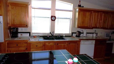 Step into comfort and style with this generously sized 3-bedroom on Schalamar Creek Golf and Country Club in Florida - for sale on GolfHomes.com, golf home, golf lot