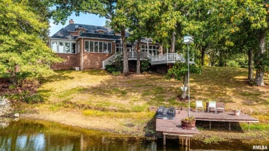 Nestled along the tranquil shores of a pristine lake, this on Carlinville Country Club in Illinois - for sale on GolfHomes.com, golf home, golf lot