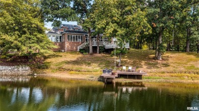 Nestled along the tranquil shores of a pristine lake, this on Carlinville Country Club in Illinois - for sale on GolfHomes.com, golf home, golf lot