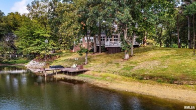 Nestled along the tranquil shores of a pristine lake, this on Carlinville Country Club in Illinois - for sale on GolfHomes.com, golf home, golf lot