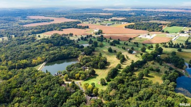 Nestled along the tranquil shores of a pristine lake, this on Carlinville Country Club in Illinois - for sale on GolfHomes.com, golf home, golf lot