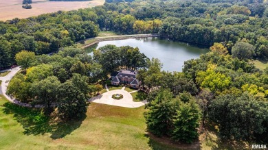 Nestled along the tranquil shores of a pristine lake, this on Carlinville Country Club in Illinois - for sale on GolfHomes.com, golf home, golf lot