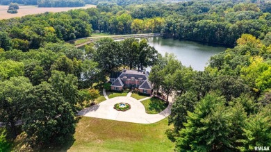 Nestled along the tranquil shores of a pristine lake, this on Carlinville Country Club in Illinois - for sale on GolfHomes.com, golf home, golf lot