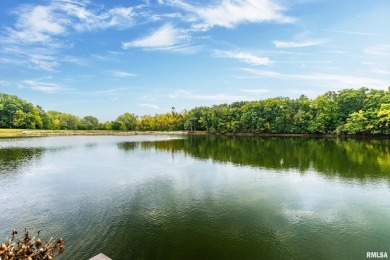 Nestled along the tranquil shores of a pristine lake, this on Carlinville Country Club in Illinois - for sale on GolfHomes.com, golf home, golf lot