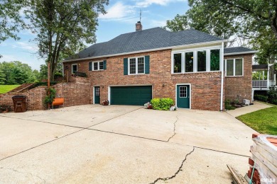 Nestled along the tranquil shores of a pristine lake, this on Carlinville Country Club in Illinois - for sale on GolfHomes.com, golf home, golf lot