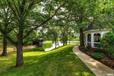 Nestled along the tranquil shores of a pristine lake, this on Carlinville Country Club in Illinois - for sale on GolfHomes.com, golf home, golf lot