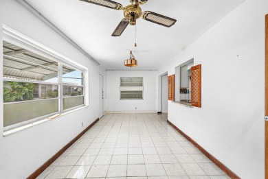 Welcome to this charming 2-bed, 2-bath single-family home on a on Leisureville Community Golf Course in Florida - for sale on GolfHomes.com, golf home, golf lot