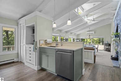 Welcome to a completely updated and enchanting 4-bedroom, 4-bath on Manitou Passage Golf Club in Michigan - for sale on GolfHomes.com, golf home, golf lot