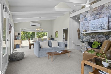 Welcome to a completely updated and enchanting 4-bedroom, 4-bath on Manitou Passage Golf Club in Michigan - for sale on GolfHomes.com, golf home, golf lot