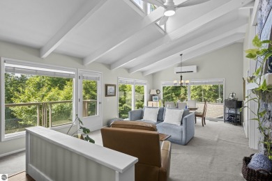 Welcome to a completely updated and enchanting 4-bedroom, 4-bath on Manitou Passage Golf Club in Michigan - for sale on GolfHomes.com, golf home, golf lot