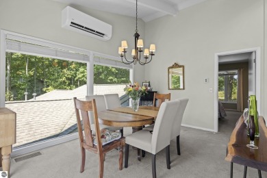 Welcome to a completely updated and enchanting 4-bedroom, 4-bath on Manitou Passage Golf Club in Michigan - for sale on GolfHomes.com, golf home, golf lot