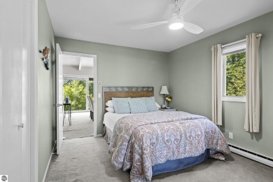 Welcome to a completely updated and enchanting 4-bedroom, 4-bath on Manitou Passage Golf Club in Michigan - for sale on GolfHomes.com, golf home, golf lot