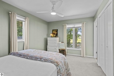 Welcome to a completely updated and enchanting 4-bedroom, 4-bath on Manitou Passage Golf Club in Michigan - for sale on GolfHomes.com, golf home, golf lot