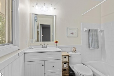 Welcome to a completely updated and enchanting 4-bedroom, 4-bath on Manitou Passage Golf Club in Michigan - for sale on GolfHomes.com, golf home, golf lot