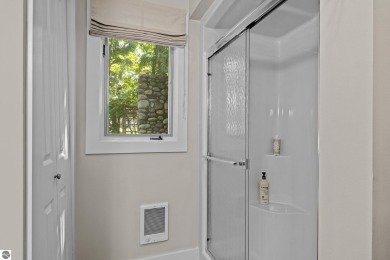 Welcome to a completely updated and enchanting 4-bedroom, 4-bath on Manitou Passage Golf Club in Michigan - for sale on GolfHomes.com, golf home, golf lot