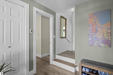 Welcome to a completely updated and enchanting 4-bedroom, 4-bath on Manitou Passage Golf Club in Michigan - for sale on GolfHomes.com, golf home, golf lot