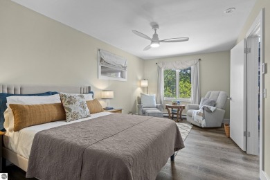 Welcome to a completely updated and enchanting 4-bedroom, 4-bath on Manitou Passage Golf Club in Michigan - for sale on GolfHomes.com, golf home, golf lot
