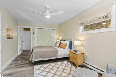 Welcome to a completely updated and enchanting 4-bedroom, 4-bath on Manitou Passage Golf Club in Michigan - for sale on GolfHomes.com, golf home, golf lot