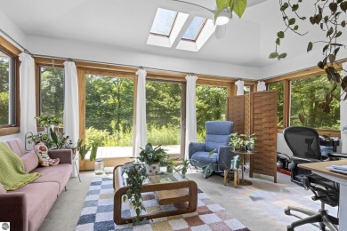 Welcome to a completely updated and enchanting 4-bedroom, 4-bath on Manitou Passage Golf Club in Michigan - for sale on GolfHomes.com, golf home, golf lot