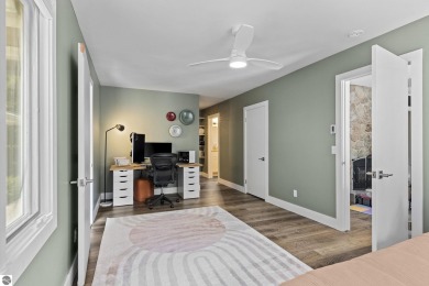 Welcome to a completely updated and enchanting 4-bedroom, 4-bath on Manitou Passage Golf Club in Michigan - for sale on GolfHomes.com, golf home, golf lot