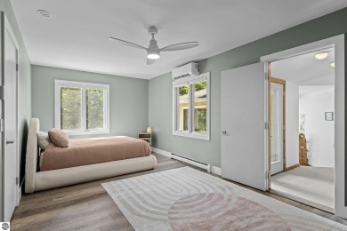 Welcome to a completely updated and enchanting 4-bedroom, 4-bath on Manitou Passage Golf Club in Michigan - for sale on GolfHomes.com, golf home, golf lot
