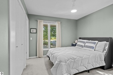 Welcome to a completely updated and enchanting 4-bedroom, 4-bath on Manitou Passage Golf Club in Michigan - for sale on GolfHomes.com, golf home, golf lot