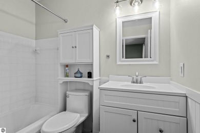 Welcome to a completely updated and enchanting 4-bedroom, 4-bath on Manitou Passage Golf Club in Michigan - for sale on GolfHomes.com, golf home, golf lot