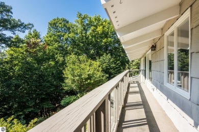 Welcome to a completely updated and enchanting 4-bedroom, 4-bath on Manitou Passage Golf Club in Michigan - for sale on GolfHomes.com, golf home, golf lot