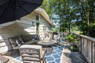Welcome to a completely updated and enchanting 4-bedroom, 4-bath on Manitou Passage Golf Club in Michigan - for sale on GolfHomes.com, golf home, golf lot