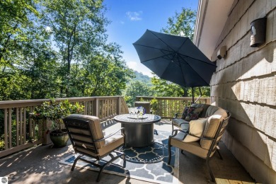 Welcome to a completely updated and enchanting 4-bedroom, 4-bath on Manitou Passage Golf Club in Michigan - for sale on GolfHomes.com, golf home, golf lot