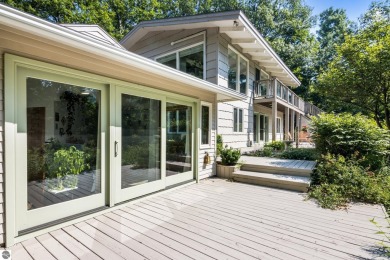 Welcome to a completely updated and enchanting 4-bedroom, 4-bath on Manitou Passage Golf Club in Michigan - for sale on GolfHomes.com, golf home, golf lot
