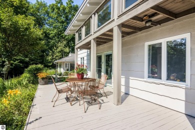 Welcome to a completely updated and enchanting 4-bedroom, 4-bath on Manitou Passage Golf Club in Michigan - for sale on GolfHomes.com, golf home, golf lot