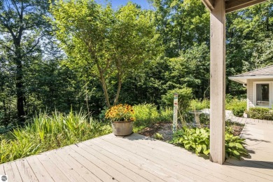 Welcome to a completely updated and enchanting 4-bedroom, 4-bath on Manitou Passage Golf Club in Michigan - for sale on GolfHomes.com, golf home, golf lot