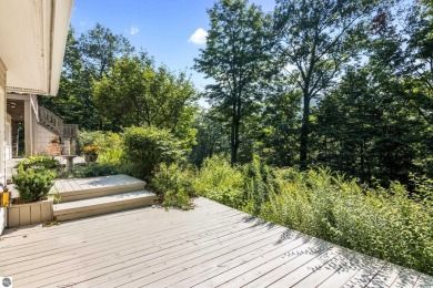 Welcome to a completely updated and enchanting 4-bedroom, 4-bath on Manitou Passage Golf Club in Michigan - for sale on GolfHomes.com, golf home, golf lot
