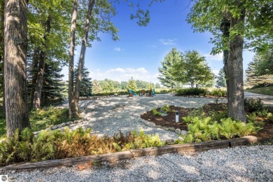 Welcome to a completely updated and enchanting 4-bedroom, 4-bath on Manitou Passage Golf Club in Michigan - for sale on GolfHomes.com, golf home, golf lot
