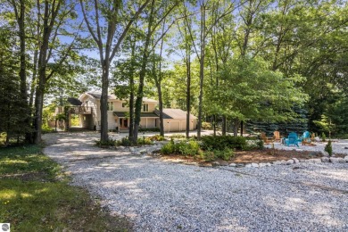 Welcome to a completely updated and enchanting 4-bedroom, 4-bath on Manitou Passage Golf Club in Michigan - for sale on GolfHomes.com, golf home, golf lot