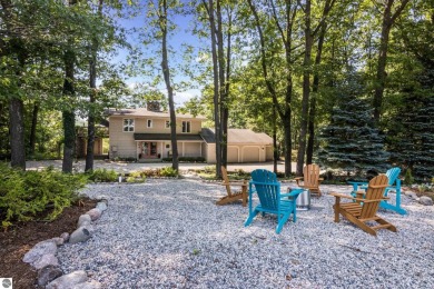 Welcome to a completely updated and enchanting 4-bedroom, 4-bath on Manitou Passage Golf Club in Michigan - for sale on GolfHomes.com, golf home, golf lot