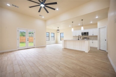This fresh and functional 3-bedroom, 2-bath home offers style on The Club At Runaway Bay in Texas - for sale on GolfHomes.com, golf home, golf lot