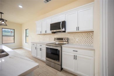 This fresh and functional 3-bedroom, 2-bath home offers style on The Club At Runaway Bay in Texas - for sale on GolfHomes.com, golf home, golf lot